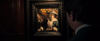 Movie still from “All the Money in the World” (2017), directed by Ridley Scott – A painting of a young girl wearing a hat and holding an umbrella; Close Up shot, Over the shoulder angle