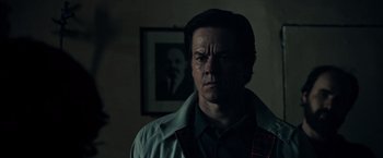 Movie still from “All the Money in the World” (2017), directed by Ridley Scott – A person in a room near a picture; Close Up shot, Low angle