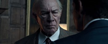 Movie still from “All the Money in the World” (2017), directed by Ridley Scott – An older man wearing a suit and tie; Close Up shot, Over the shoulder angle