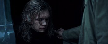 Movie still from “All the Money in the World” (2017), directed by Ridley Scott – A woman is getting her hair cut by a man; Close Up shot, Over the shoulder angle