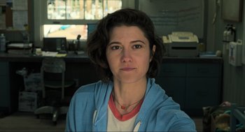 Movie still from “Gemini Man” (2019), directed by Ang Lee – A person wearing a blue jacket; Close Up shot, Low angle