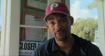 Movie still from “Gemini Man” (2019), directed by Ang Lee – A person wearing a hat; Close Up shot, Over the shoulder angle