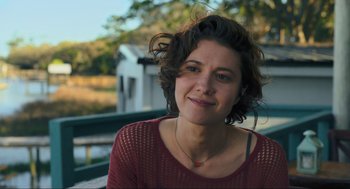 Movie still from “Gemini Man” (2019), directed by Ang Lee – A person sitting on a bench; Close Up shot, Over the shoulder angle