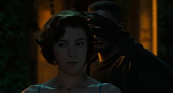 Movie still from “Gemini Man” (2019), directed by Ang Lee – A woman standing next to a man with a mask on; Close Up shot, Over the shoulder angle