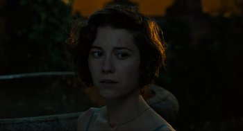 Movie still from “Gemini Man” (2019), directed by Ang Lee – A young woman with short brown hair is looking at the camera; Close Up shot, Over the shoulder angle