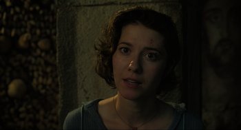 Movie still from “Gemini Man” (2019), directed by Ang Lee – A young woman with short brown curly hair; Close Up shot, Low angle