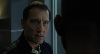 Movie still from “Gemini Man” (2019), directed by Ang Lee – A person looking at the camera; Close Up shot, Over the shoulder angle