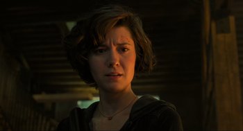 Movie still from “Gemini Man” (2019), directed by Ang Lee – A person with short brown hair; Close Up shot, Over the shoulder angle