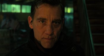 Movie still from “Gemini Man” (2019), directed by Ang Lee – A person wearing a black jacket; Close Up shot, Low angle