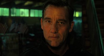 Movie still from “Gemini Man” (2019), directed by Ang Lee – A person wearing a black shirt; Close Up shot, Low angle