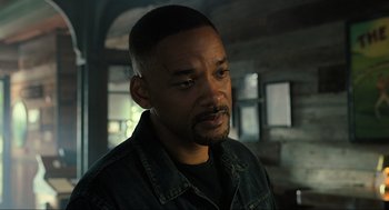 Movie still from “Gemini Man” (2019), directed by Ang Lee – A person wearing a jean jacket; Close Up shot, Over the shoulder angle