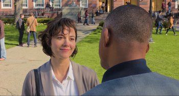 Movie still from “Gemini Man” (2019), directed by Ang Lee – A woman standing next to a man on a sidewalk; Close Up shot, Over the shoulder angle