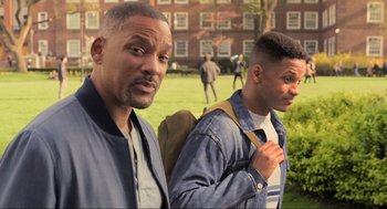 Movie still from “Gemini Man” (2019), directed by Ang Lee – Two men standing next to each other in front of a building; Close Up shot, High angle