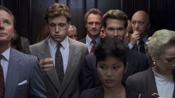 Movie still from “Ghost” (1990), directed by Jerry Zucker – A group of men and women standing in front of each other; Medium shot, High angle