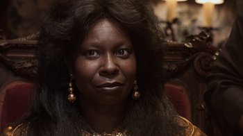 Movie still from “Ghost” (1990), directed by Jerry Zucker – A person with long black hair; Close Up shot, Low angle