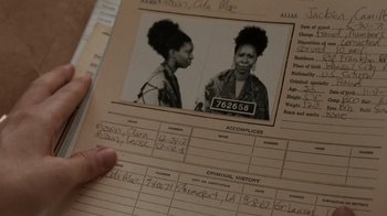 Movie still from “Ghost” (1990), directed by Jerry Zucker – An old photo of a woman in a jail cell; Extreme Close Up shot, Low angle