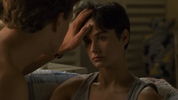 Movie still from “Ghost” (1990), directed by Jerry Zucker – A man touching the forehead of a young woman; Close Up shot, High angle