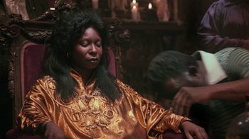 Movie still from “Ghost” (1990), directed by Jerry Zucker – A woman sitting in a chair with her eyes closed; Medium shot, Low angle