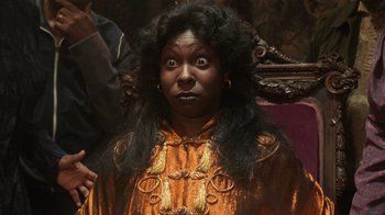 Movie still from “Ghost” (1990), directed by Jerry Zucker – A woman with long black hair wearing a yellow dress; Close Up shot, High angle