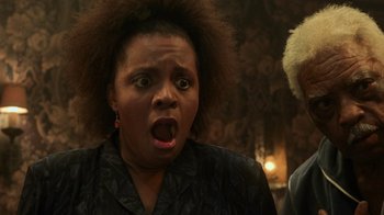 Movie still from “Ghost” (1990), directed by Jerry Zucker – An image of a woman making a funny face; Close Up shot, Low angle