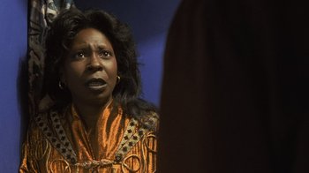 Movie still from “Ghost” (1990), directed by Jerry Zucker – An african american woman looking at a mirror; Close Up shot, Over the shoulder angle