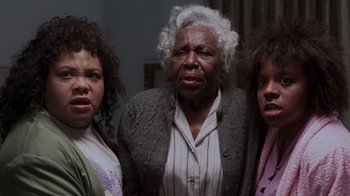 Movie still from “Ghost” (1990), directed by Jerry Zucker – A group of three women standing next to each other; Close Up shot, Low angle