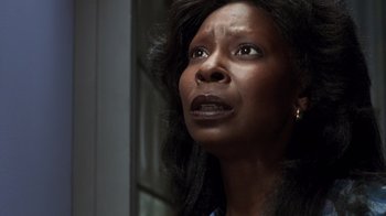 Movie still from “Ghost” (1990), directed by Jerry Zucker – A person with long black hair; Close Up shot, Low angle