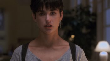 Movie still from “Ghost” (1990), directed by Jerry Zucker – A person with short black hair; Close Up shot, Over the shoulder angle