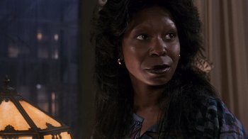 Movie still from “Ghost” (1990), directed by Jerry Zucker – A woman with long black hair looking at the camera; Close Up shot, Low angle