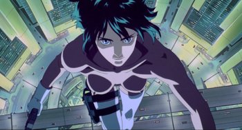 Movie still from “Ghost in the Shell” (1995), directed by Mamoru Oshii – A woman's face from a cartoon; Medium shot, Low angle