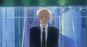 Movie still from “Ghost in the Shell” (1995), directed by Mamoru Oshii – An older man in a suit and tie; Medium shot, Low angle