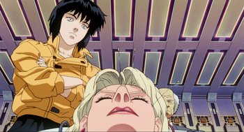 Movie still from “Ghost in the Shell” (1995), directed by Mamoru Oshii – A woman's face in front of another woman's face; Close Up shot, Low angle