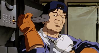 Movie still from “Ghost in the Shell” (1995), directed by Mamoru Oshii – An animated picture of a baseball player holding a baseball bat; Close Up shot, Low angle