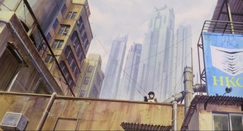 Movie still from “Ghost in the Shell” (1995), directed by Mamoru Oshii – An animated scene of a city with buildings and wires; Extreme Wide shot, Low angle