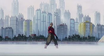 Movie still from “Ghost in the Shell” (1995), directed by Mamoru Oshii – A man standing in front of a city skyline; Extreme Wide shot, Low angle