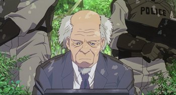 Movie still from “Ghost in the Shell” (1995), directed by Mamoru Oshii – An old man in a suit and a tie; Close Up shot, Low angle