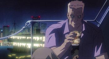 Movie still from “Ghost in the Shell” (1995), directed by Mamoru Oshii – An older man sitting on a bench holding a cup; Medium shot, Low angle