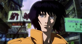 Movie still from “Ghost in the Shell” (1995), directed by Mamoru Oshii – A person with short black hair; Close Up shot, Low angle