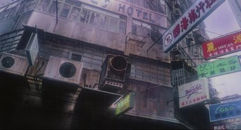 Movie still from “Ghost in the Shell” (1995), directed by Mamoru Oshii – An old building has a large hole in it's wall; Extreme Wide shot, Low angle
