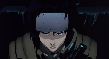 Movie still from “Ghost in the Shell” (1995), directed by Mamoru Oshii – An animated picture of a person with a helmet on his head; Close Up shot, Low angle