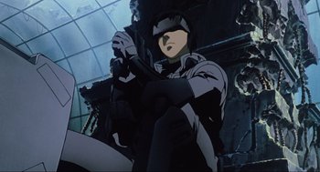 Movie still from “Ghost in the Shell” (1995), directed by Mamoru Oshii – An animated picture of a person holding a gun; Medium shot, Low angle