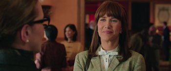 Movie still from “Ghostbusters” (2016), directed by Paul Feig – A person wearing a bow tie; Close Up shot, Over the shoulder angle