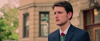 Movie still from “Ghostbusters” (2016), directed by Paul Feig – A man in a suit and tie looking to his left; Close Up shot, Over the shoulder angle