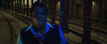 Movie still from “Ghostbusters” (2016), directed by Paul Feig – A woman standing in the dark with her mouth wide open; Close Up shot, Over the shoulder angle