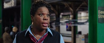 Movie still from “Ghostbusters” (2016), directed by Paul Feig – A woman with a surprised look on her face; Close Up shot, Over the shoulder angle