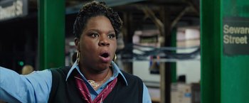 Movie still from “Ghostbusters” (2016), directed by Paul Feig – A woman with a surprised look on her face; Close Up shot, Low angle
