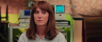 Movie still from “Ghostbusters” (2016), directed by Paul Feig – A person wearing a sweater; Close Up shot, Over the shoulder angle