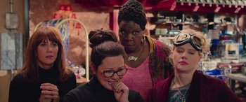 Movie still from “Ghostbusters” (2016), directed by Paul Feig – Two women standing next to each other in a room; Close Up shot, Over the shoulder angle