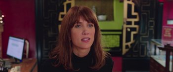 Movie still from “Ghostbusters” (2016), directed by Paul Feig – A person with long hair; Close Up shot, Over the shoulder angle