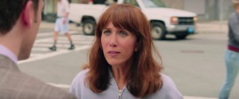 Movie still from “Ghostbusters” (2016), directed by Paul Feig – A person with long brown hair; Close Up shot, Over the shoulder angle